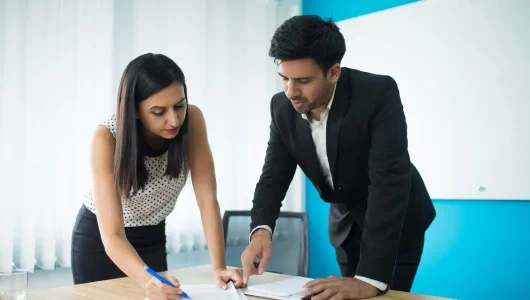 imgi_1_serious-businessman-businesswoman-signing-contract_1262-18033